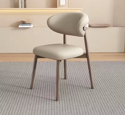 Beige chair in a room with a neutral color scheme
