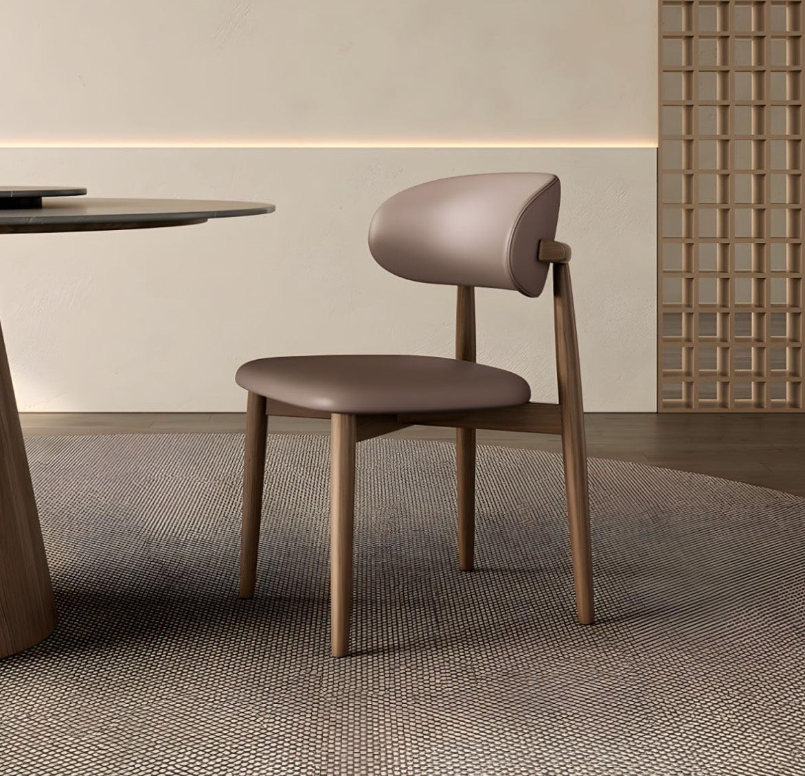 Modern chair with wooden frame and brown seat in a minimalistic room.