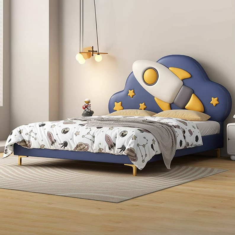 A child's bed with a rocket ship design, featuring a blue and yellow color scheme, with stars and a cartoonish rocket ship graphic on the headboard.