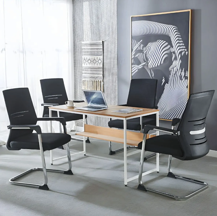 Modern office setup with black chairs and a wooden table.