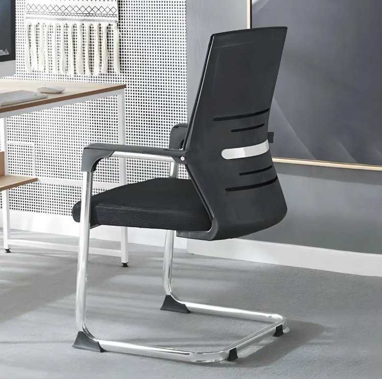 Modern black office chair with a sleek design in an office setting.