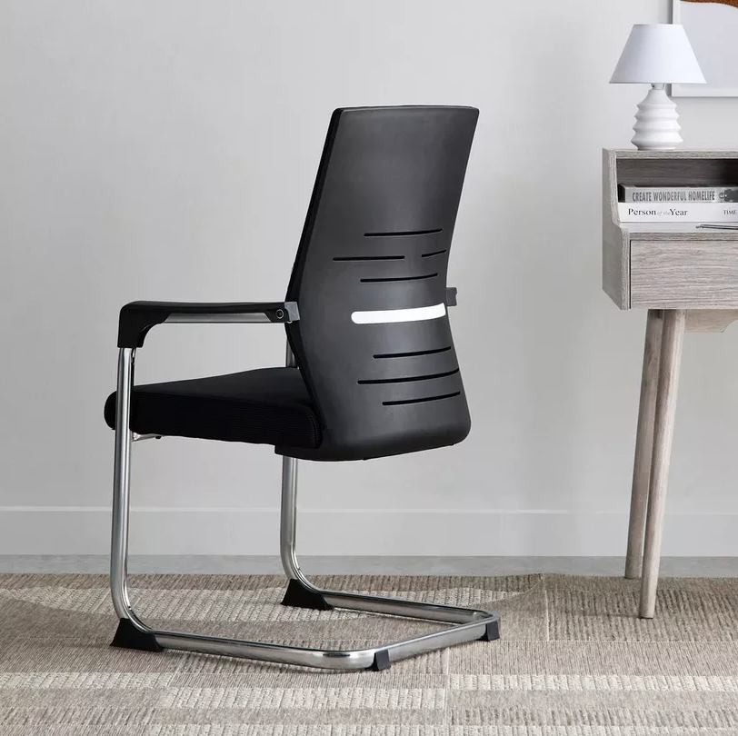 Black office chair with chrome legs in an office setting