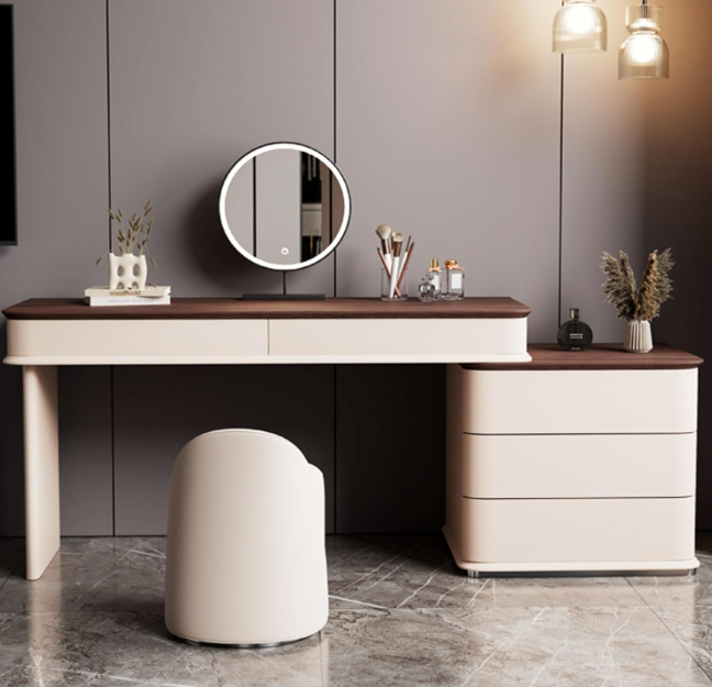 Modern dressing table with round mirror, lights, and decorative items in a room.