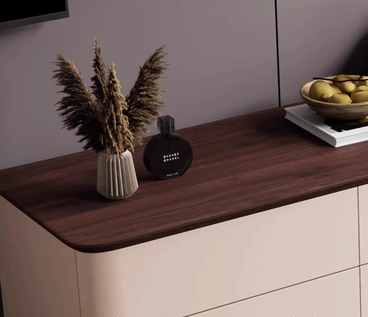 Wooden surface with decorative items including a vase, bottle, and bowl.