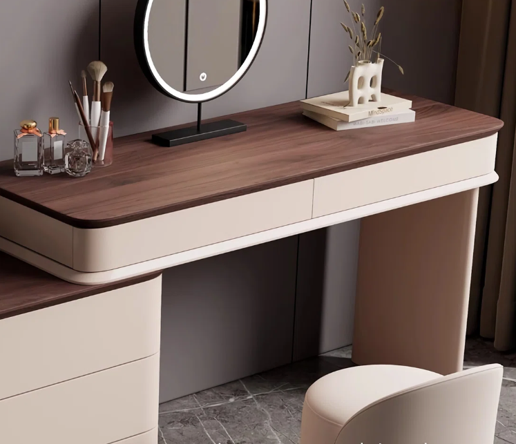 Dressing table with wooden top and beige base, featuring a mirror and decorative items.