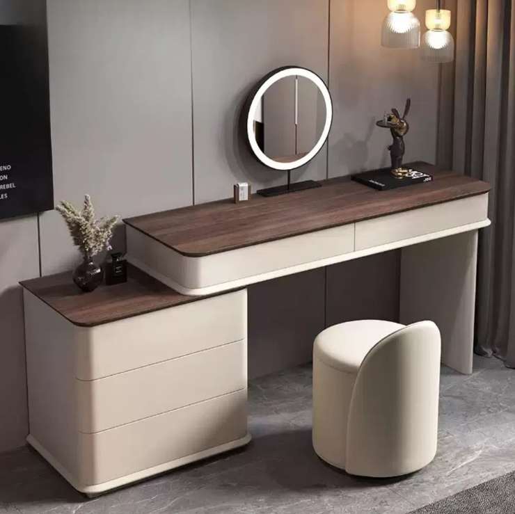 Dressing table with a round mirror and stool in a room setting