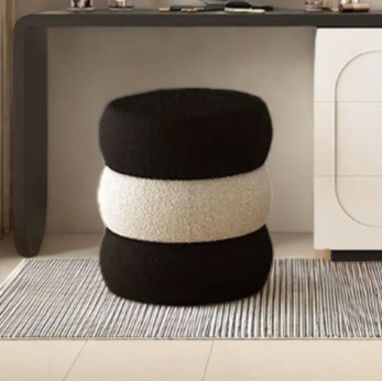 Modern room interior with a vanity table, mirror, and decorative items.