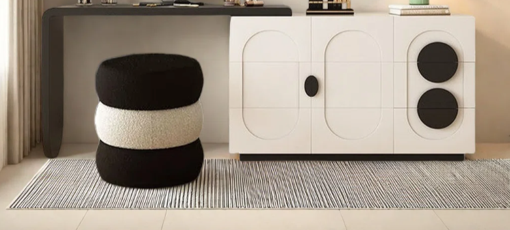 Modern interior with a vanity table, mirror, and decorative items.