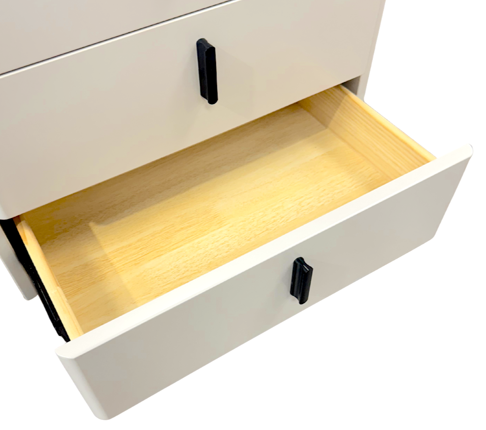 White cabinet with an open drawer revealing a wooden interior.