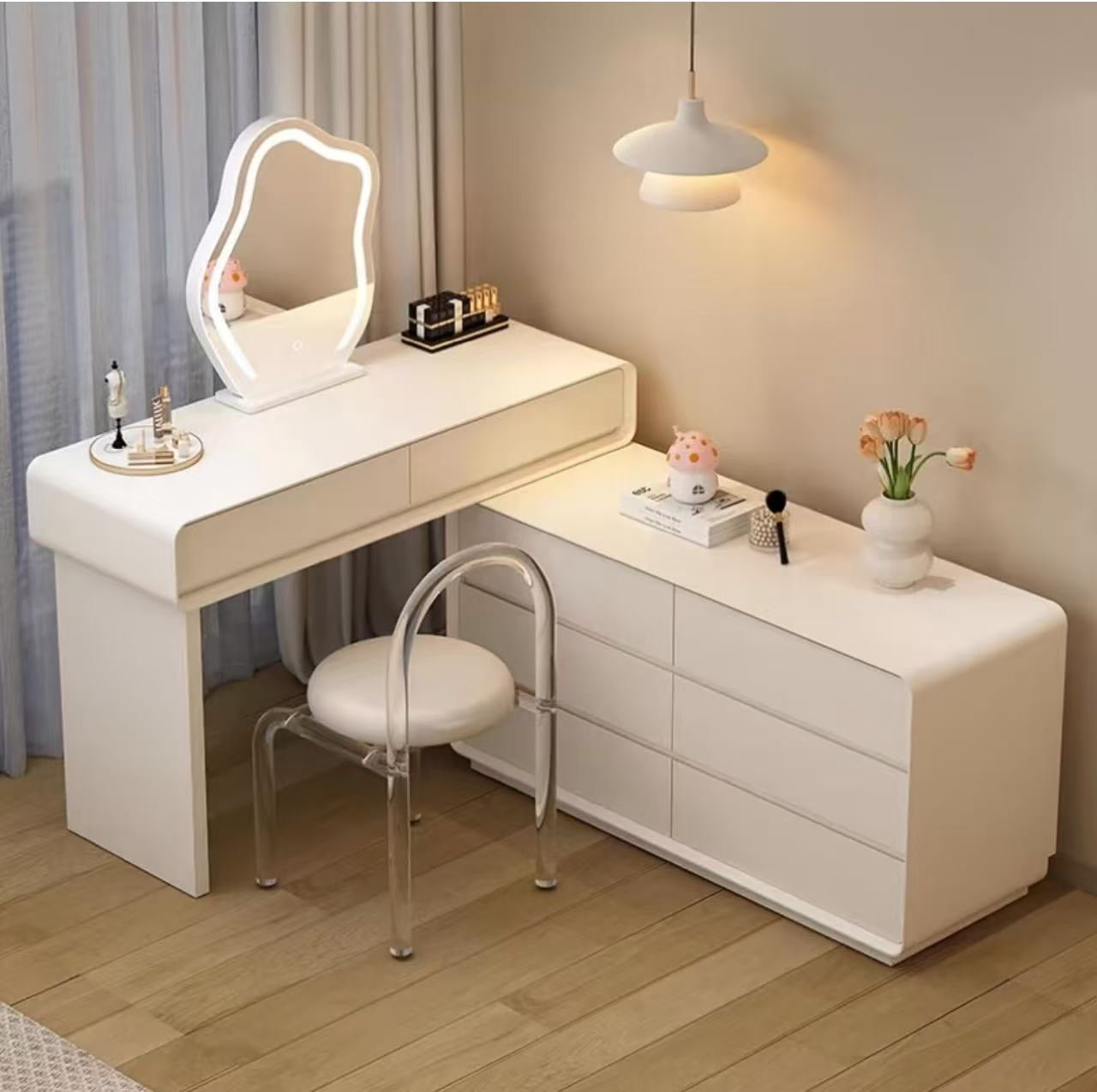White vanity table with mirror and chair in a room setting