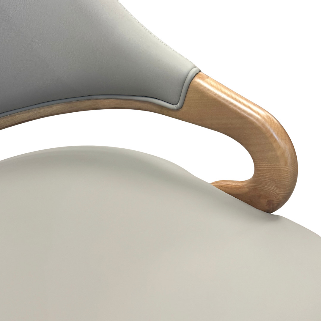 Close-up of a chair with a wooden armrest on a white background