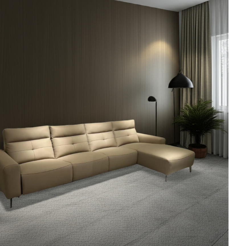 Beige sectional sofa in a modern living room with a dark wall and gray carpet.