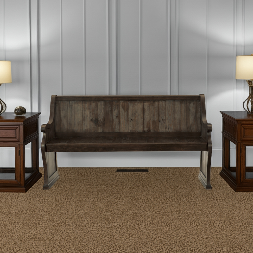 Wooden bench in a room with two matching side tables and lamps.
