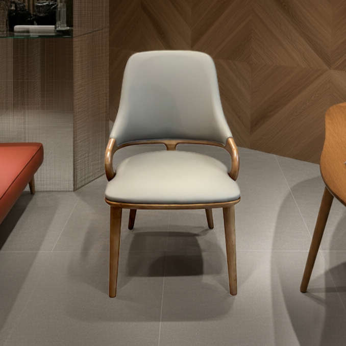 Modern chair in a room with wooden wall and table