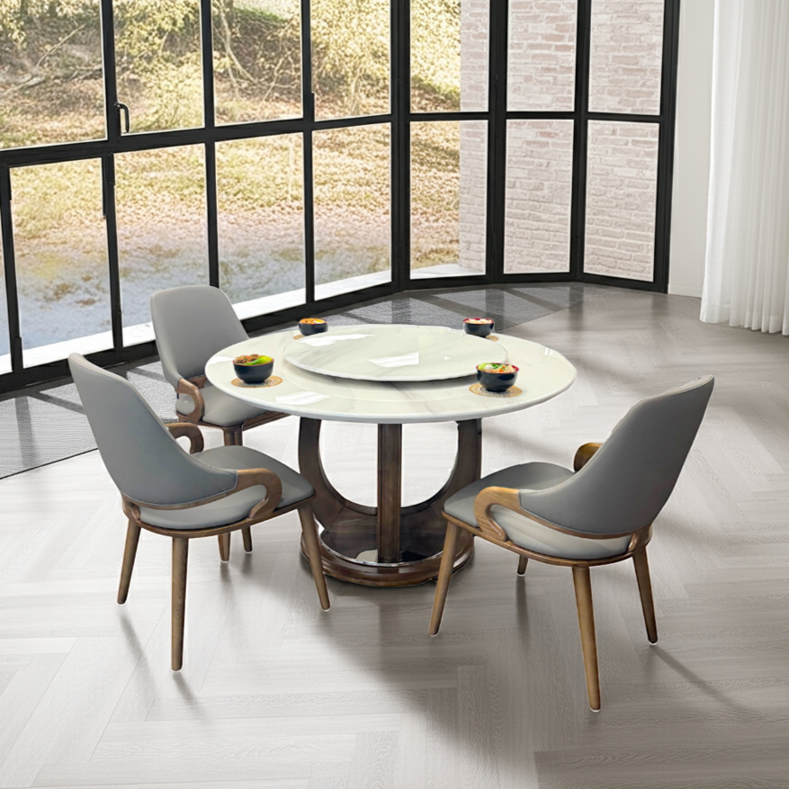 Dining table with chairs in a modern room with large windows.