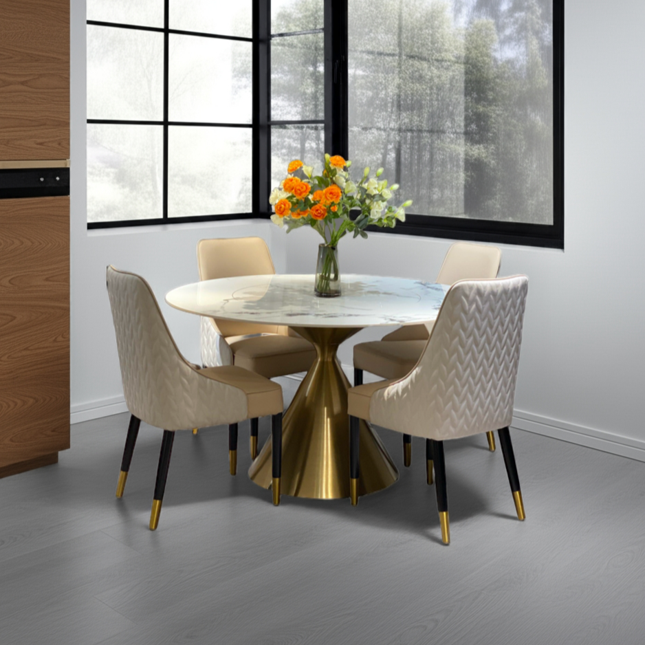 Dining room with a round table and chairs in a modern interior setting.
