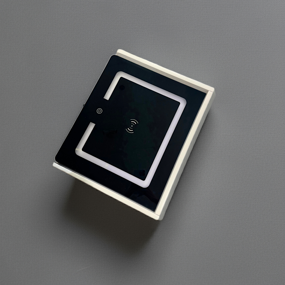 Square electronic component with a black square in the center on a gray background