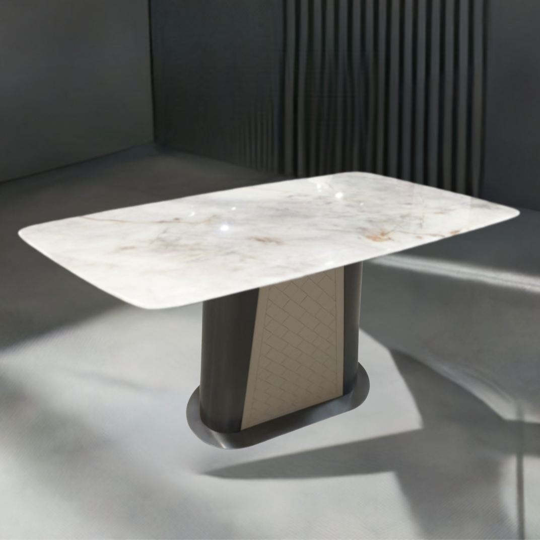 Dining table with marble-like surface and dark base in a modern setting