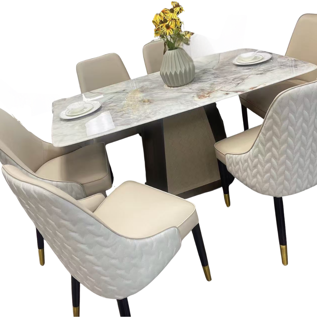Dining table set with marble-like surface and chairs on a white background