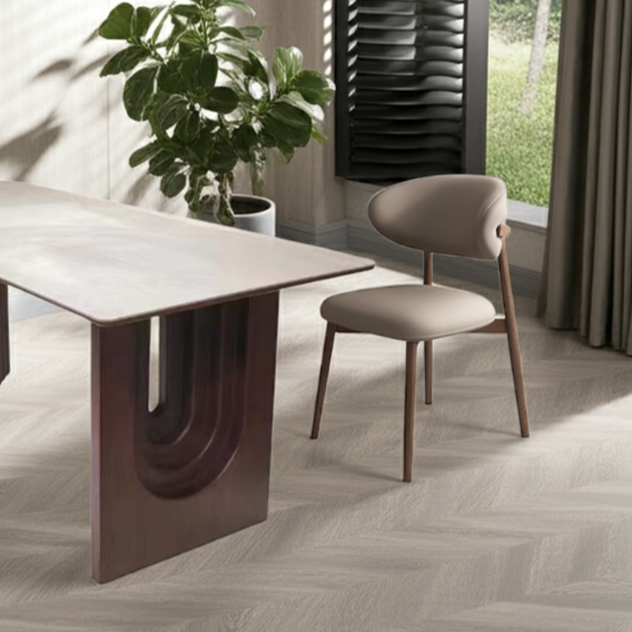 Modern dining table with a chair in a room with a window and plant