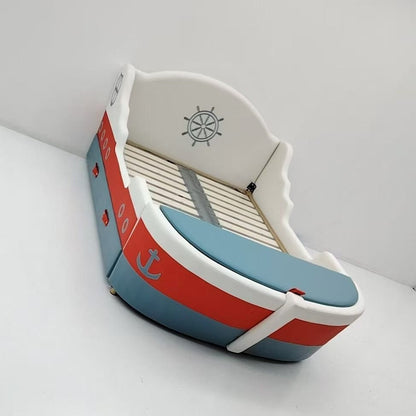 Small model boat with a white base, red stripe, and blue top on a white background