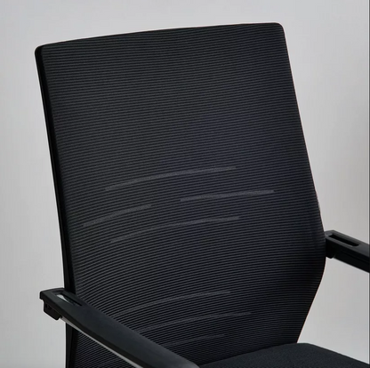Black office chair with mesh backrest on a plain background