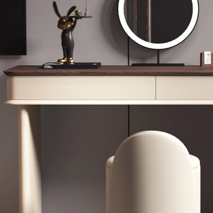 Modern console table with decorative items and a chair in a minimalistic setting
