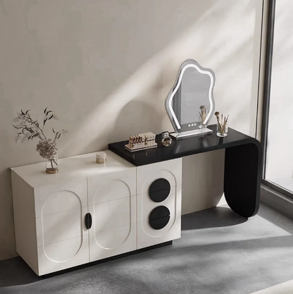 Modern vanity table with mirror and decorative items in a minimalistic room.