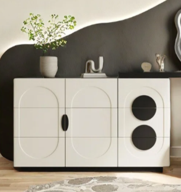Modern bathroom with a black and white vanity unit, mirror, and decorative elements.