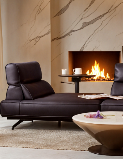 Modern living room with a black leather sofa and a fireplace genesis furniture