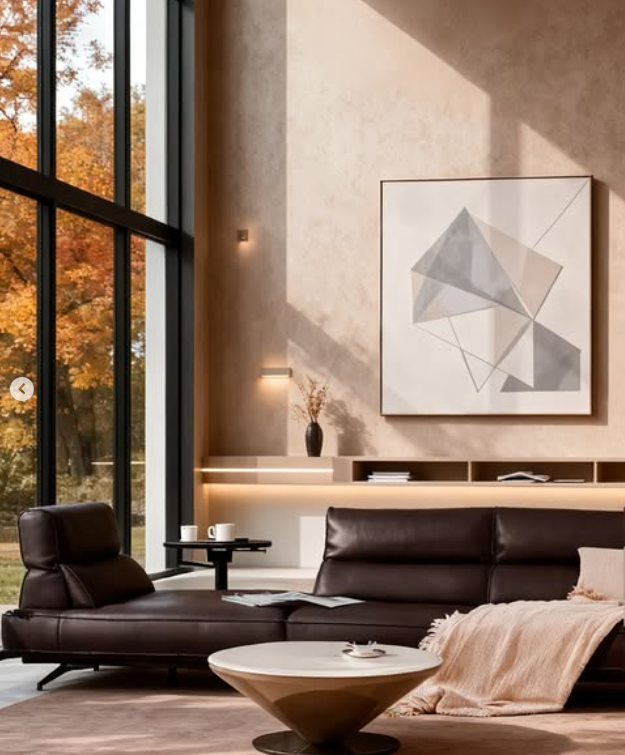 Modern living room with brown leather sofa, coffee table, and abstract art on wall genesis furniture