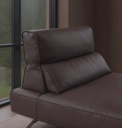 Brown leather armchair in a room with large windows genesis furniture