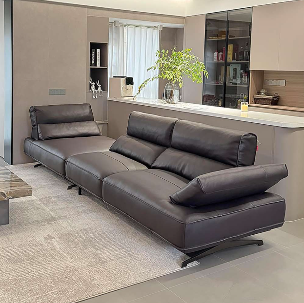 black sectional sofa in a modern living room setting with a kitchen in the background genesis furniture