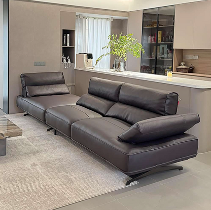 black sectional sofa in a modern living room setting with a kitchen in the background genesis furniture