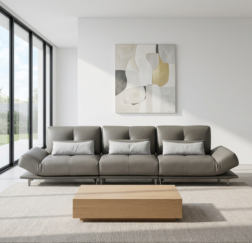 Modern living room with a gray sectional sofa, wooden coffee table, and abstract art on the wall genesis furniture