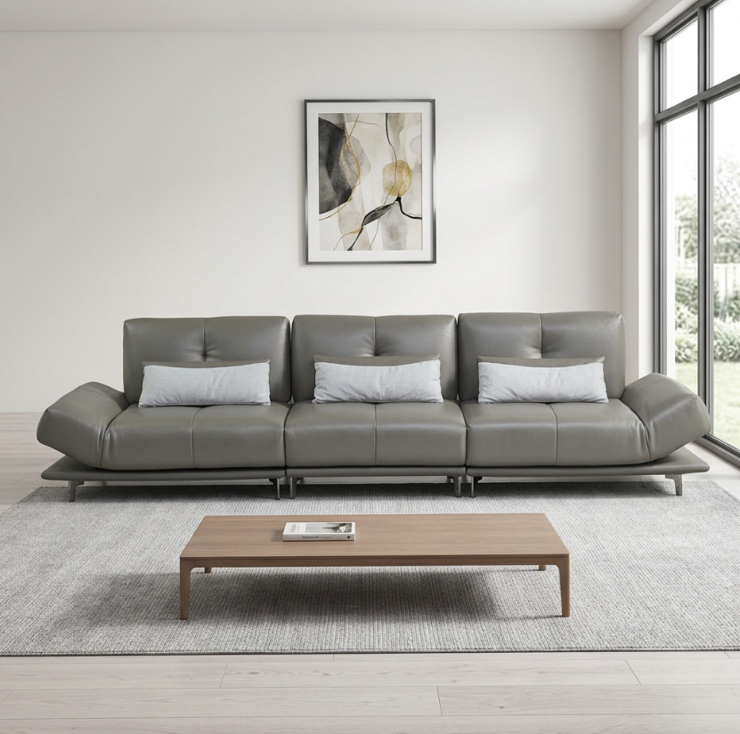 Gray sectional sofa in a modern living room with a coffee table and artwork on the wall genesis furniture