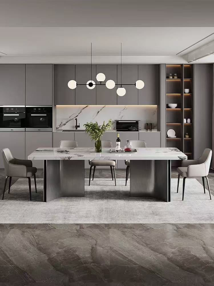 Modern kitchen with a dining table and chairs in a stylish interior design.