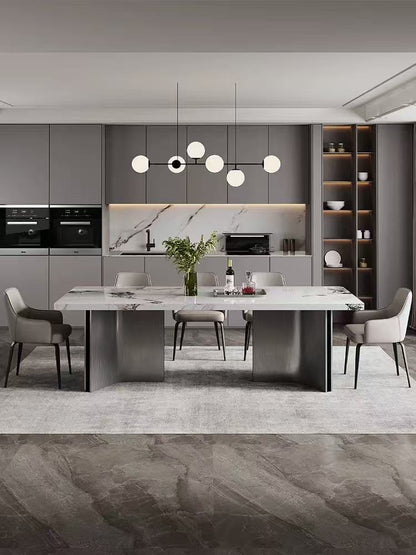 Modern kitchen with a dining table and chairs in a stylish interior design.