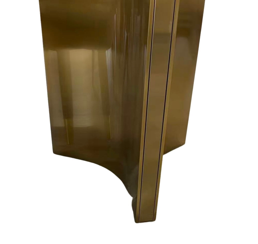 Bronze-colored metallic object on a white background