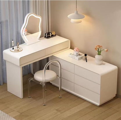 White vanity table with mirror and chair in a room setting