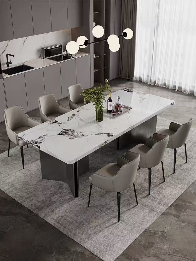 Modern dining room with a marble table and chairs in a stylish kitchen.