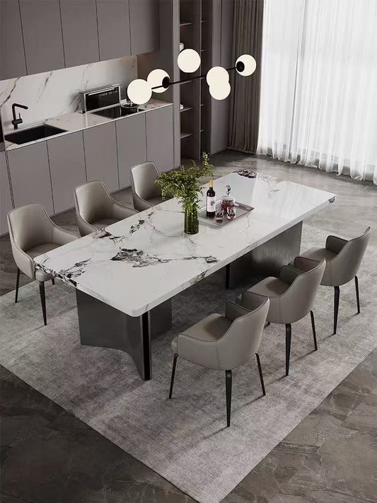 Modern dining room with a marble table and chairs in a stylish kitchen.