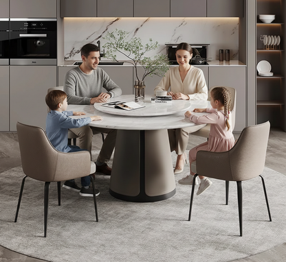 Family of four sitting around a modern dining table in a stylish kitchen.