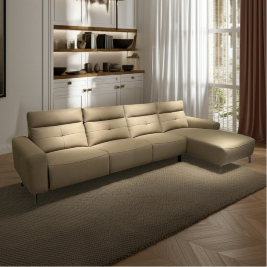 Beige sectional sofa in a modern living room with wooden floor and large window.