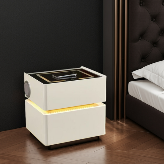 Modern nightstand with LED lighting next to a bed in a bedroom setting.
