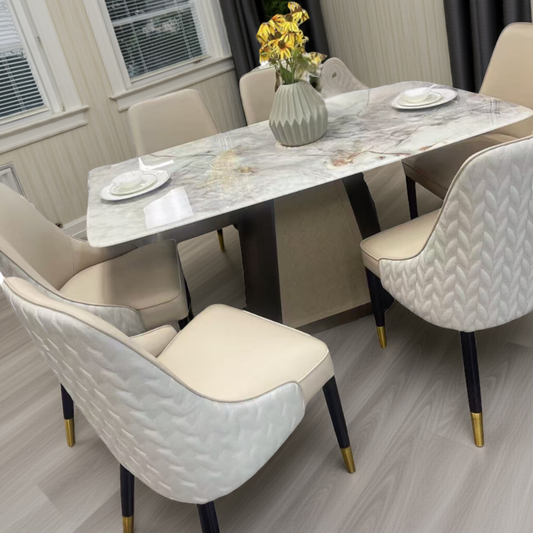 Dining room with marble table and beige chairs
