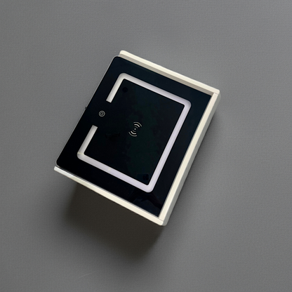 Square electronic component with a black square in the center on a gray background