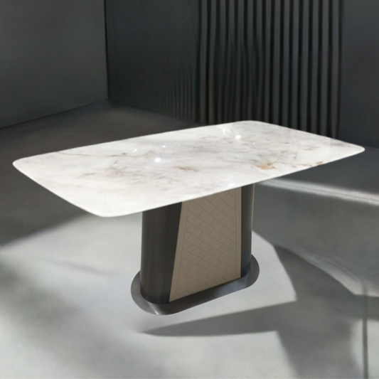 Dining table with marble-like surface and dark base in a modern setting