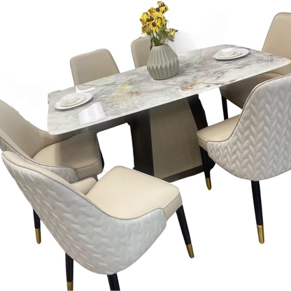 Dining table set with marble-like surface and chairs on a white background