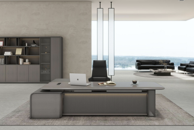 Modern office interior with a large desk, chairs, and bookshelves.
